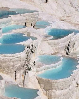 White travertine terraces with turquoise thermal pools at Pamukkale, Turkey