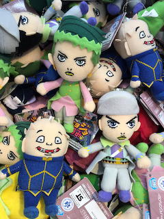 Pile of JoJo's Bizarre Adventure character plushies in colorful outfits