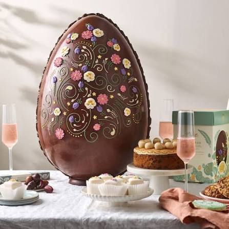 Easter bunny with colorful decorated eggs in a spring setting