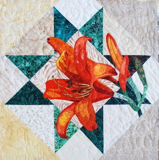 Orange tiger lily flower with spotted petals in bloom