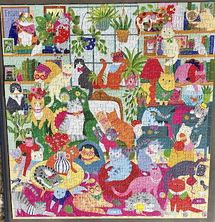 Colorful collage of whimsical characters, flowers, and creatures in a playful garden scene