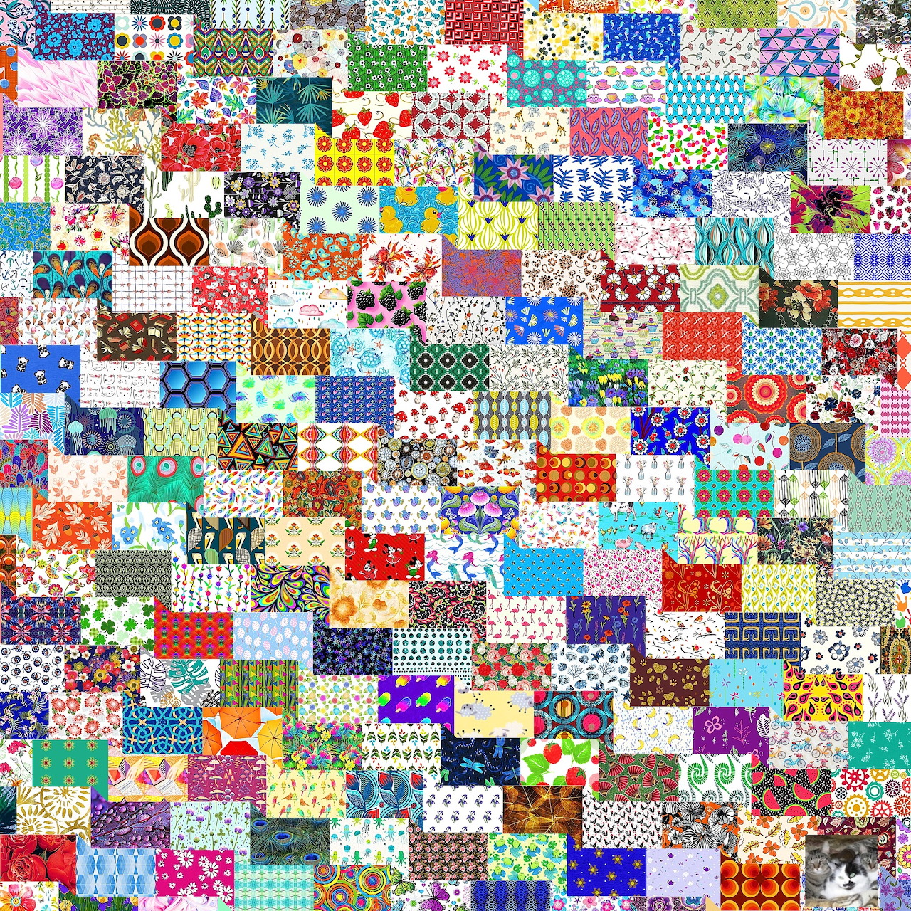 Colorful patchwork quilt made of small square fabric patches in various patterns and colors arranged in a dense grid