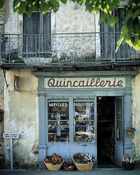 Vintage hardware store facade with display window and signage