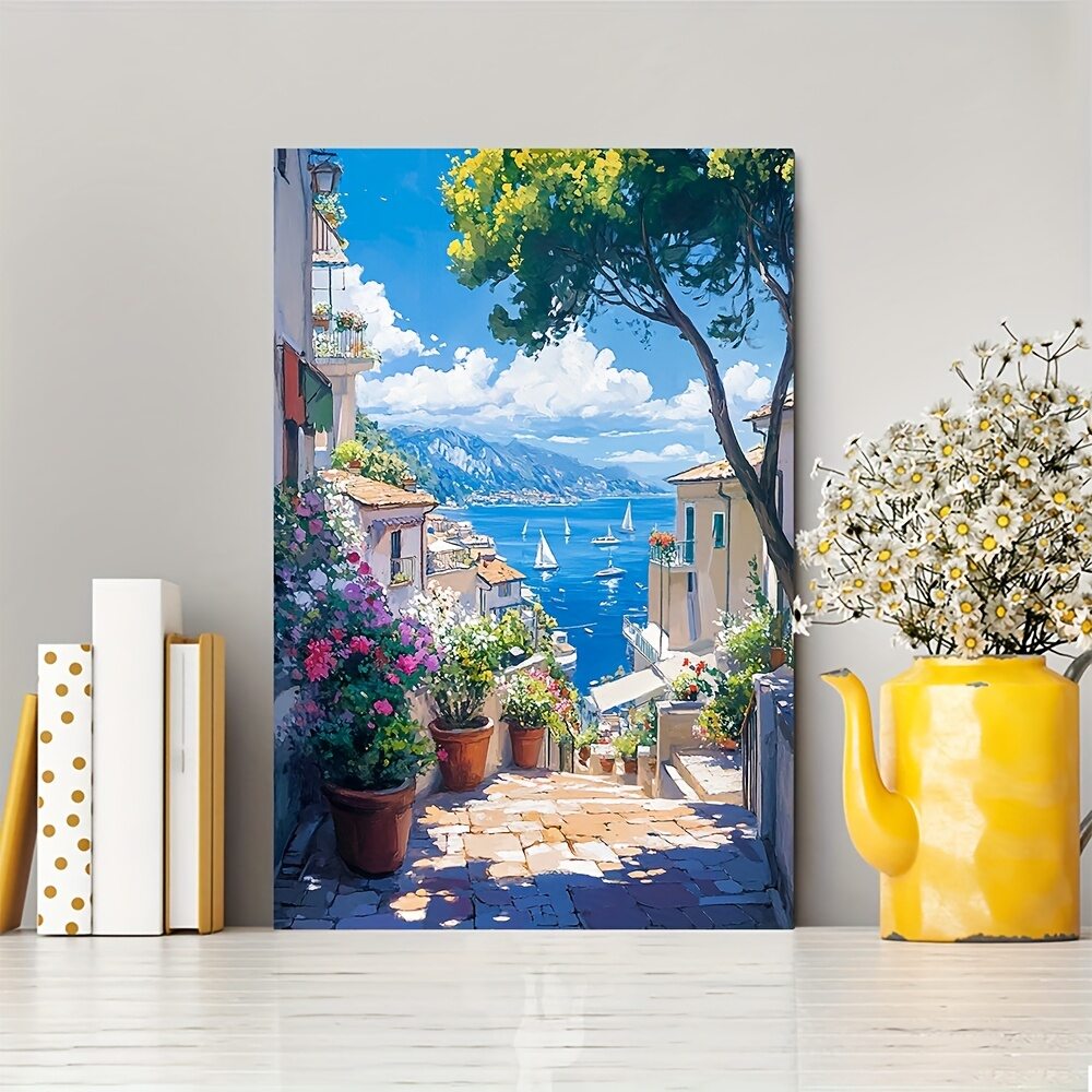 Mediterranean coastal painting beside books and a yellow vase of white flowers
