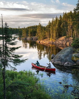 Canoe on Calm Forest Lake