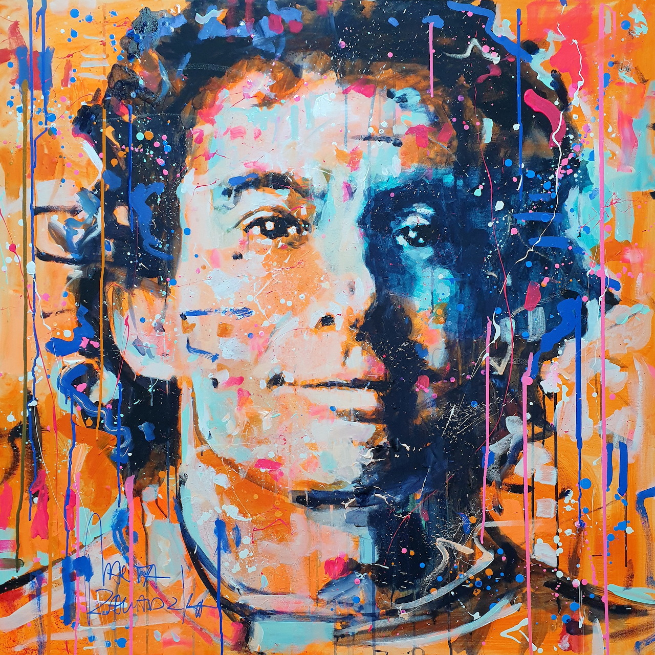 Colorful abstract portrait of a man with dark hair, blue and orange paint splatters, warm smile