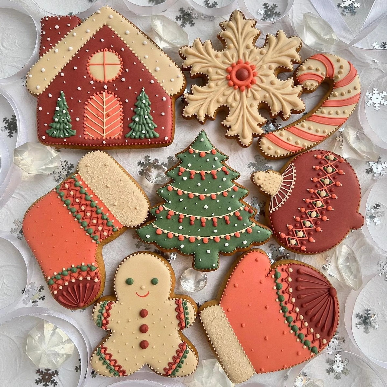 Assorted decorated Christmas cookies on a white festive background
