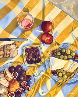 Painting of a picnic spread with grapes, figs, cheese, bread, olives, and rosé wine on a yellow striped blanket