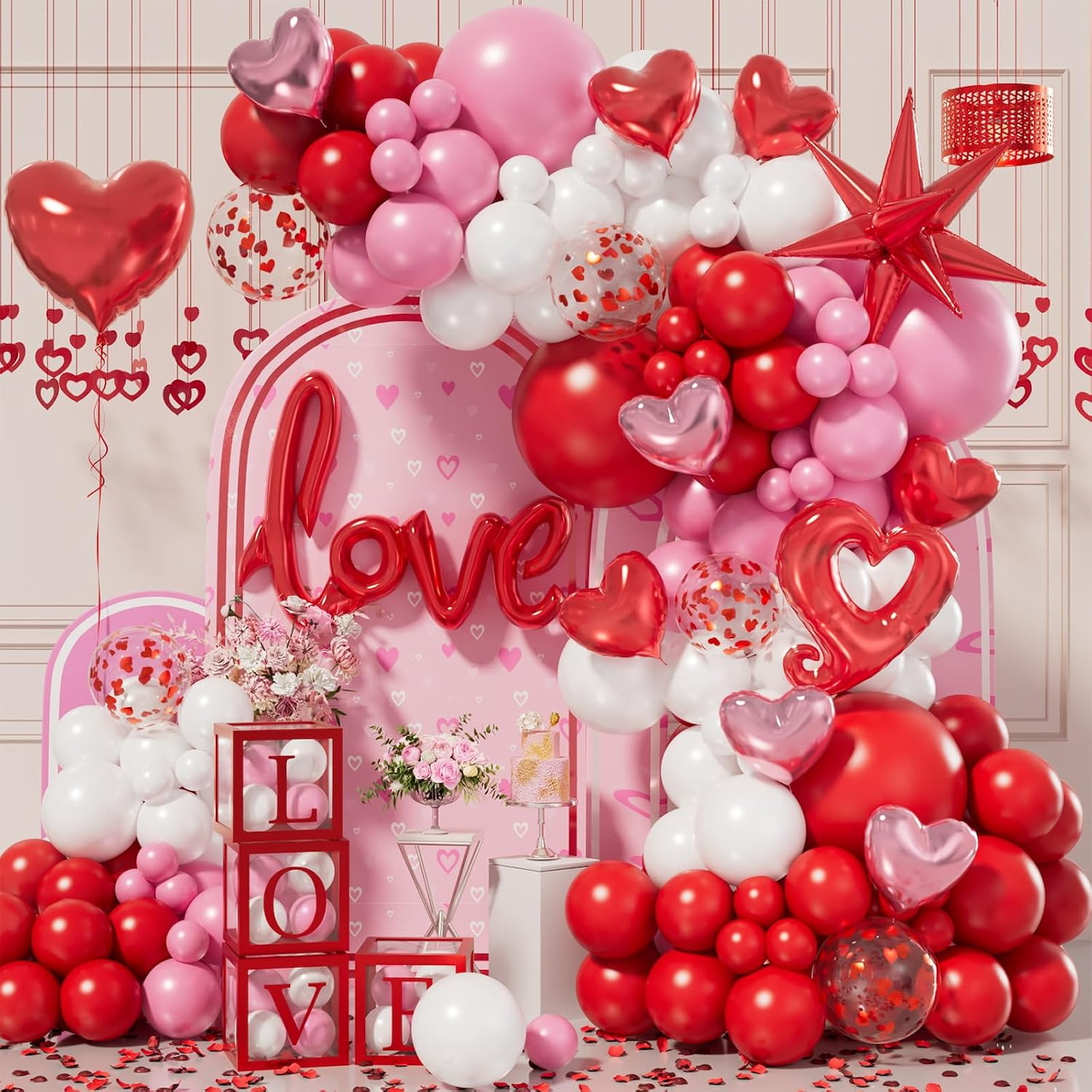 Valentine balloon backdrop with heart balloons and a pink love-themed display