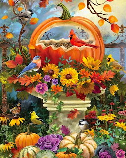 Decorative pumpkin bird feeder with colorful autumn flowers, various songbirds, butterflies and fall harvest display
