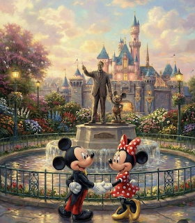 Mickey and Minnie Mouse holding hands near a Walt Disney statue with Disneyland castle in the background