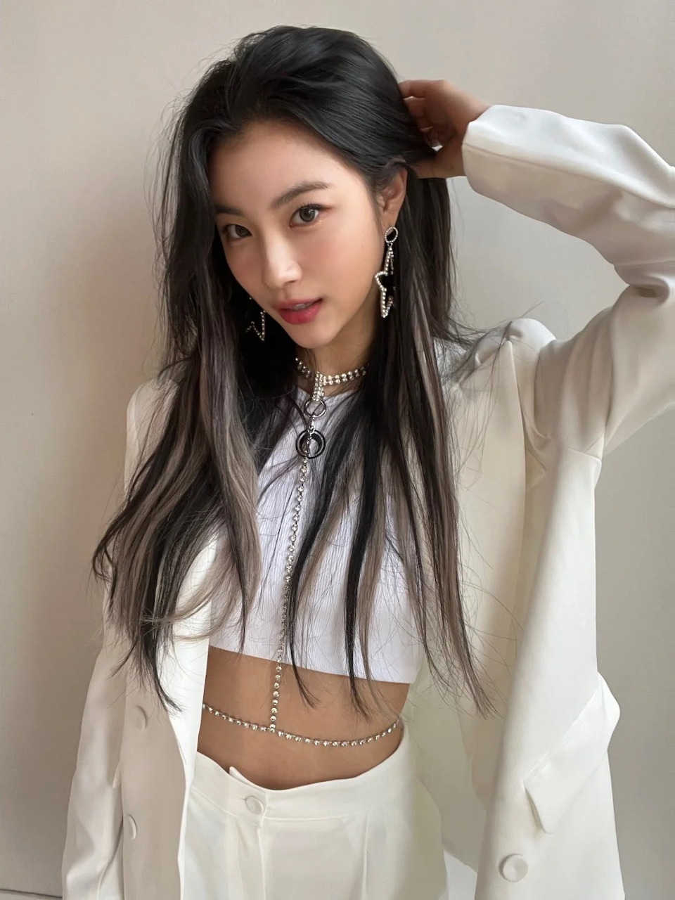 Young female K-pop idol posing for a promotional portrait.