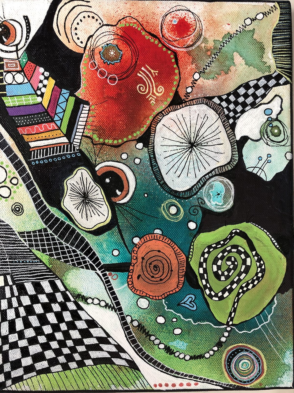 Abstract painting with colorful shapes, spirals, and checkerboard patterns on a black background