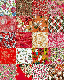Patchwork quilt squares with floral and geometric fabric patterns in red, pink, and brown