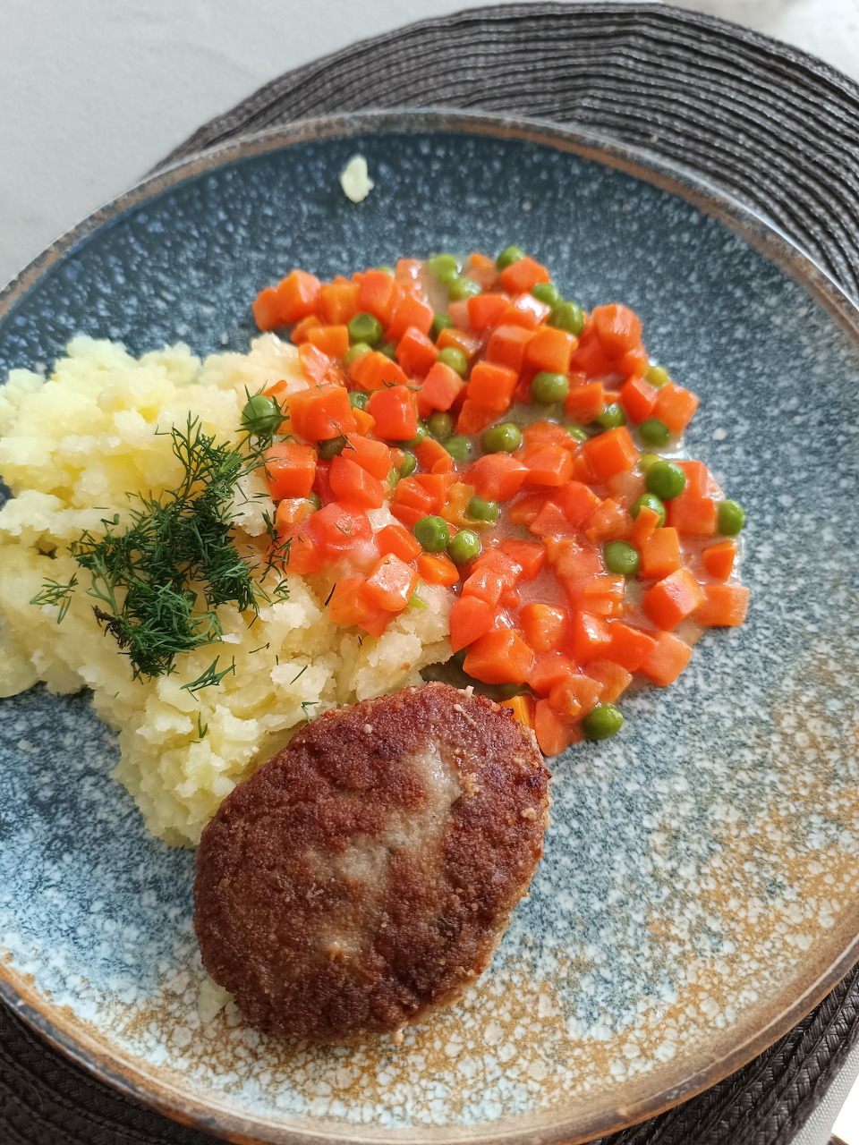 Polish meatballs served with cooked carrots on a plate