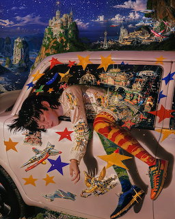 Fantasy painted car hood with castles, dragons, and stars on ornate white surface