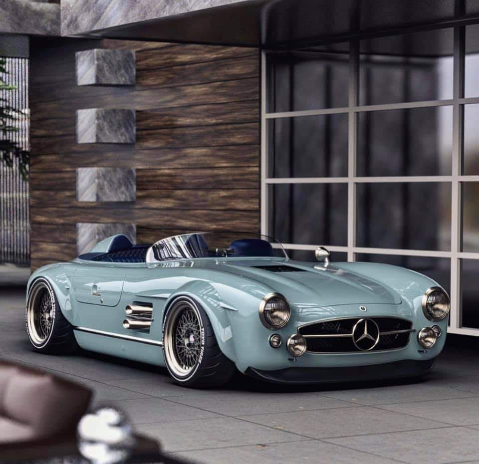 Light blue classic Mercedes convertible parked in front of a modern building