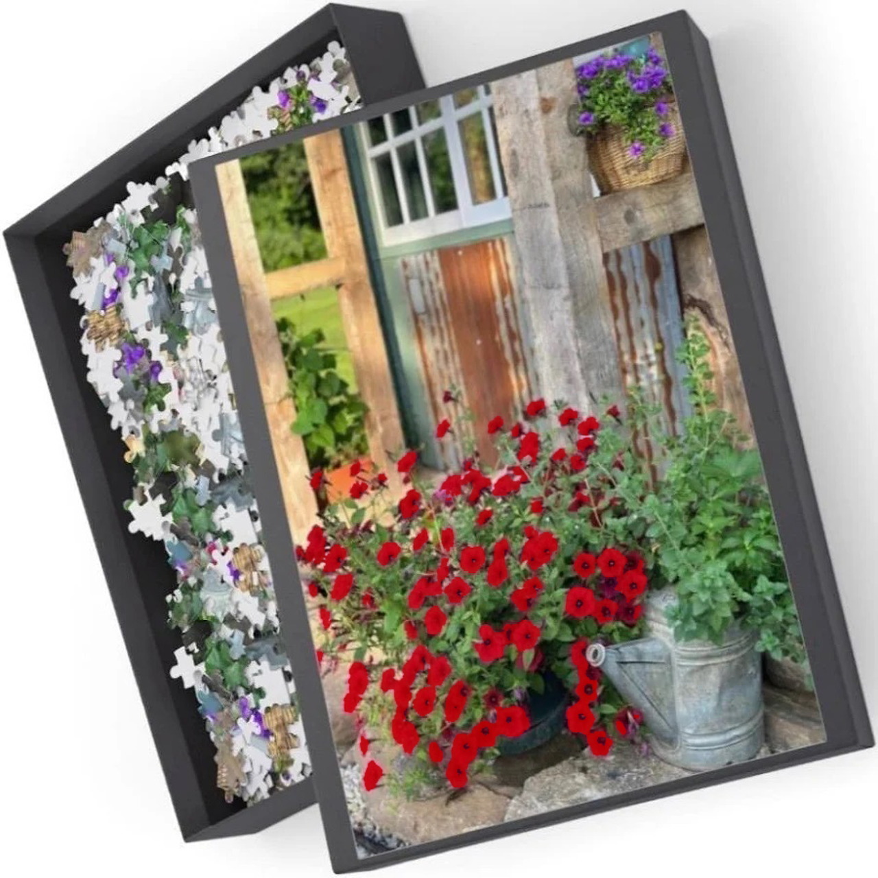 Red petunias blooming by cottage window with stone wall and greenery
