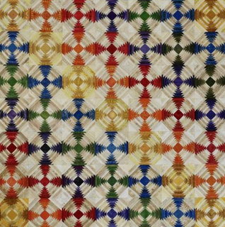 Pineapple log cabin quilt with multicolored geometric blocks arranged in repeating pattern
