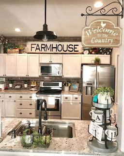 Cozy farmhouse kitchen with white cabinetry, open shelves, and rustic country decor