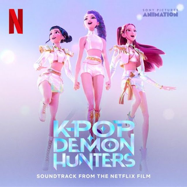 Three animated female characters in white outfits standing heroically with cloudy sky background