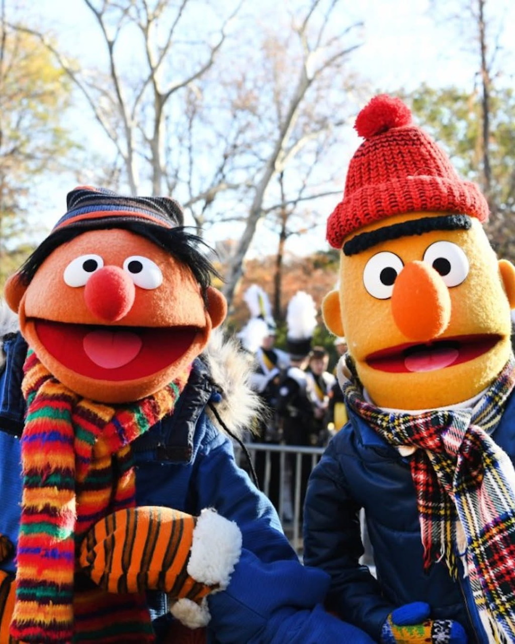 Ernie and Bert Sesame Street characters in winter hats and scarves at the Macy's Thanksgiving Day Parade
