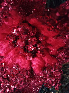 Close-up of red sequins and glitter with sparkling reflections