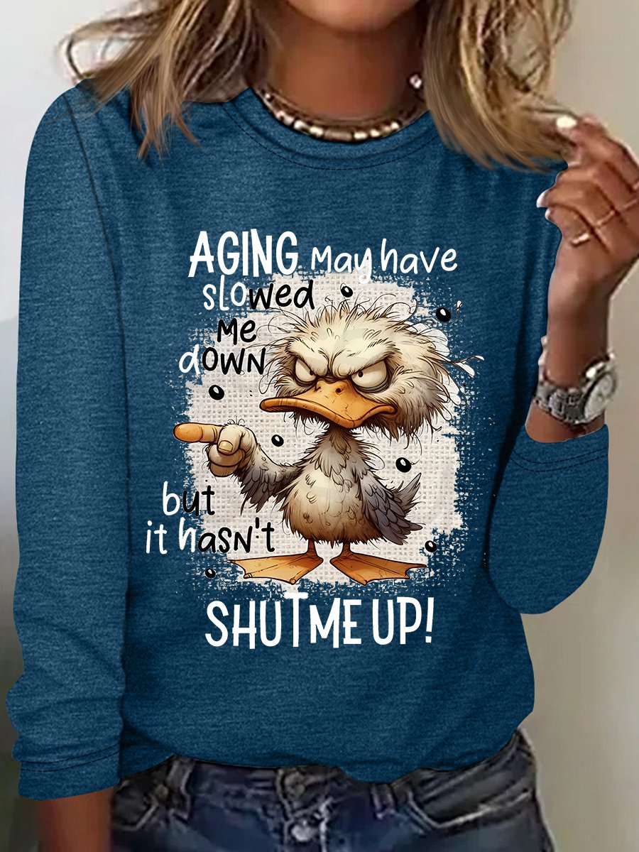 Woman in teal sweatshirt featuring grumpy fluffy cat image with text about aging
