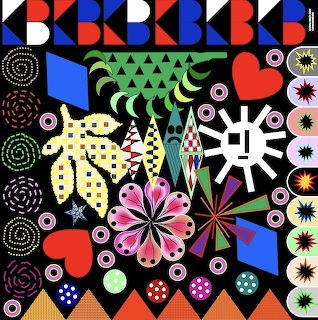 Colorful geometric collage with abstract shapes, flowers, circles and patterns on black background