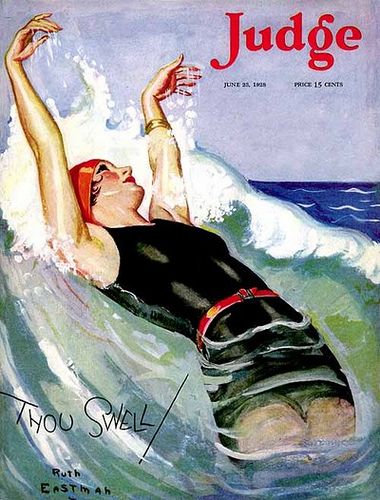 Woman in striped vintage swimsuit playfully splashing in ocean waves