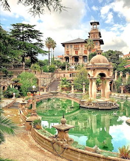 Villa Grock in Liguria with ornamental gardens, green pool, stone gazebo and tower