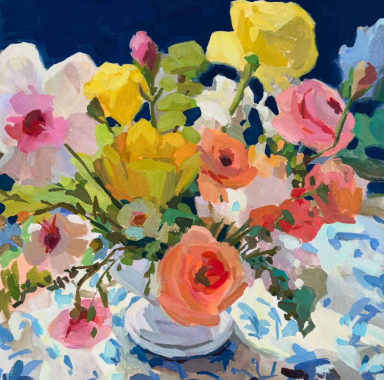 Impressionist style painting of colorful flowers including roses and poppies in a white vase with blue floral pattern