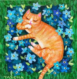 Orange tabby cat curled up sleeping in blue forget-me-not flowers