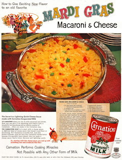 Vintage magazine ad showing baked mac and cheese with colorful peppers in ornate silver dish