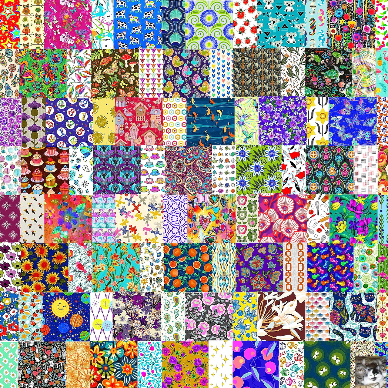 Colorful patchwork quilt with diverse floral and geometric patterns arranged in a grid of fabric squares