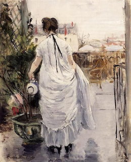 Woman on Balcony Overlooking Cityscape