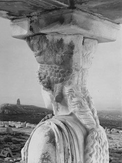 Ancient Greek Caryatid statue column from Erechtheion temple at Acropolis Athens with draped stone clothing