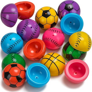 Colorful plastic toy balls and matching cup halves arranged on white background