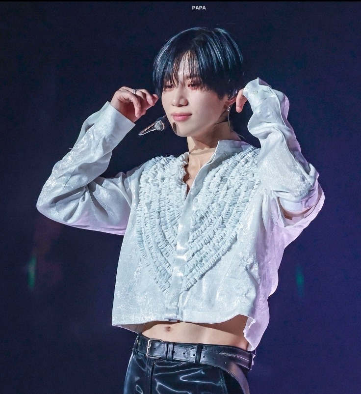 Taemin from SHINee posing in a stylish portrait
