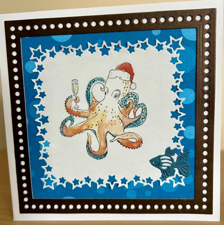 Handmade Christmas card with an illustrated octopus wearing a Santa hat and star borders
