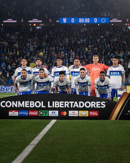 Universidad Católica football team lined up for group photo before Copa Libertadores match at night