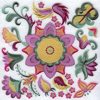 Colorful embroidered floral design with purple flower center, birds, leaves and decorative swirls