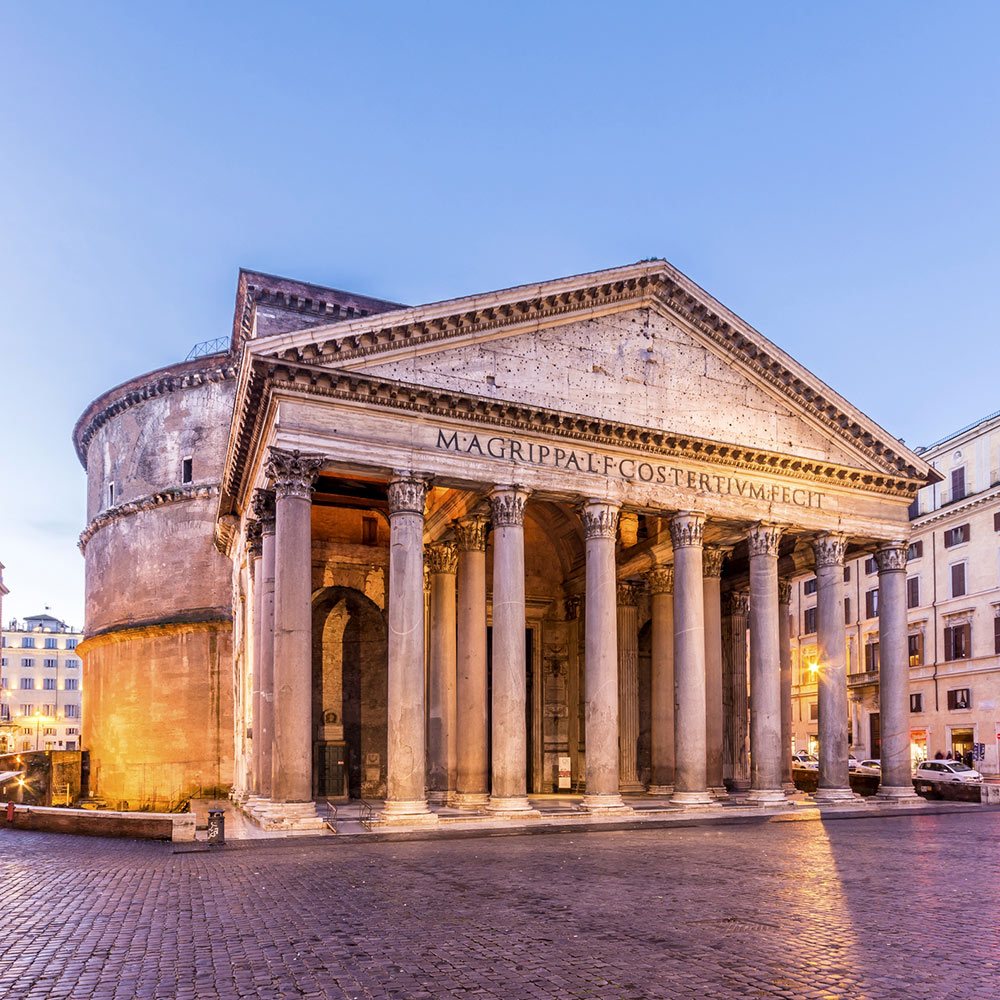The Pantheon in Rome at dusk with columns, stone facade, and cobblestone square