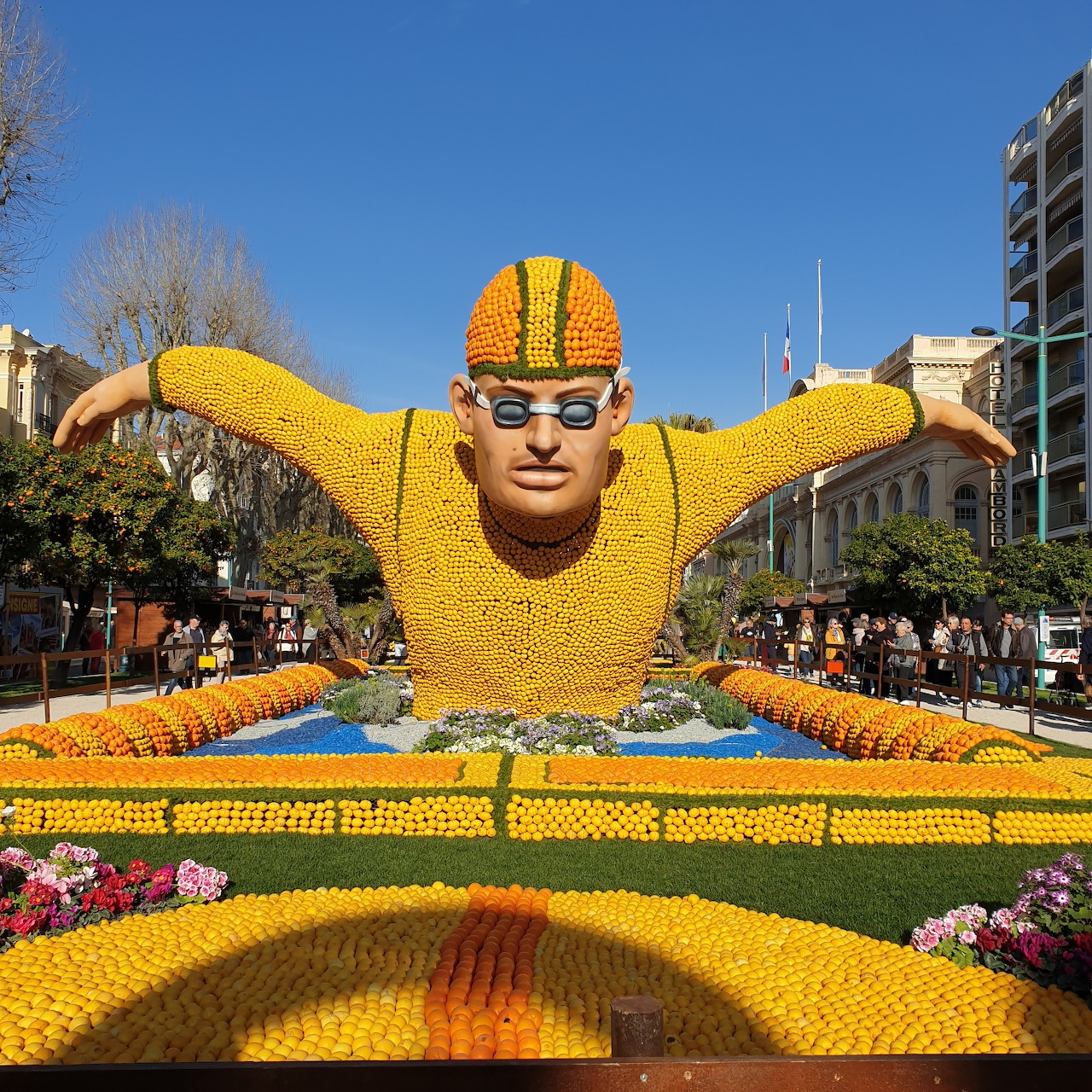 Giant Egyptian pharaoh sculpture made of lemons and oranges at outdoor citrus festival