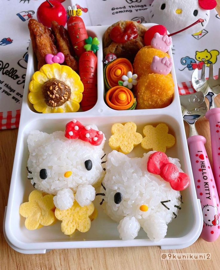 Hello Kitty themed lunch plate with character-shaped food and colorful sides