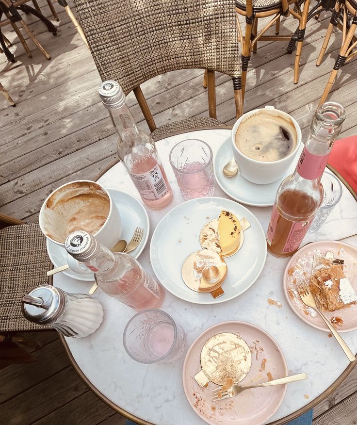 Outdoor cafe table with coffee drinks and assorted desserts