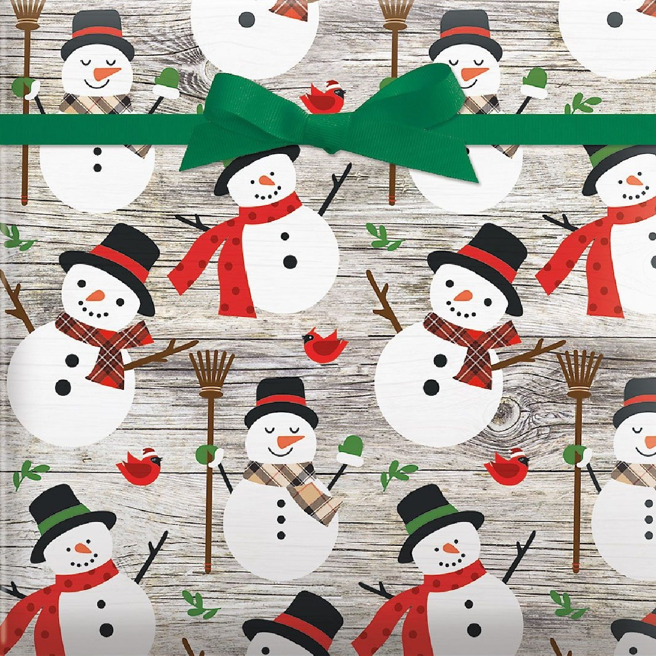 Repeating snowman pattern with top hats, scarves, and red cardinals on wood background with green ribbon