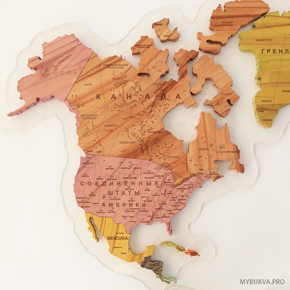 Wooden jigsaw map of North America with carved borders and engraved labels
