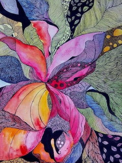 Colorful quilted fabric flower with patterned petals and detailed stitching on textured background