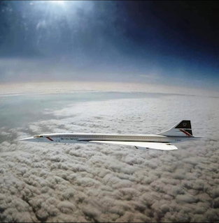 Concorde supersonic jet flying high above clouds with curved horizon